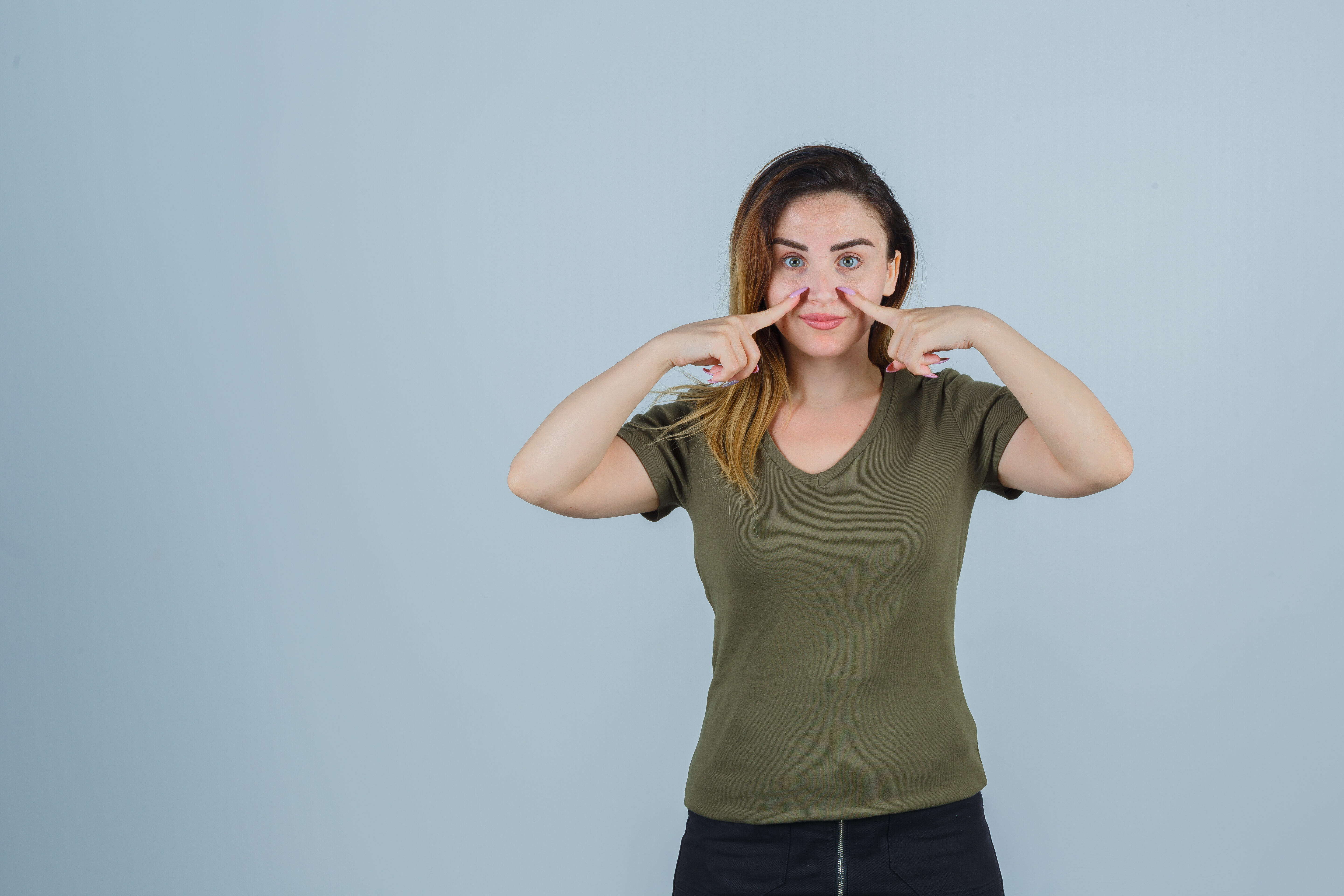 Expressive young lady posing studio