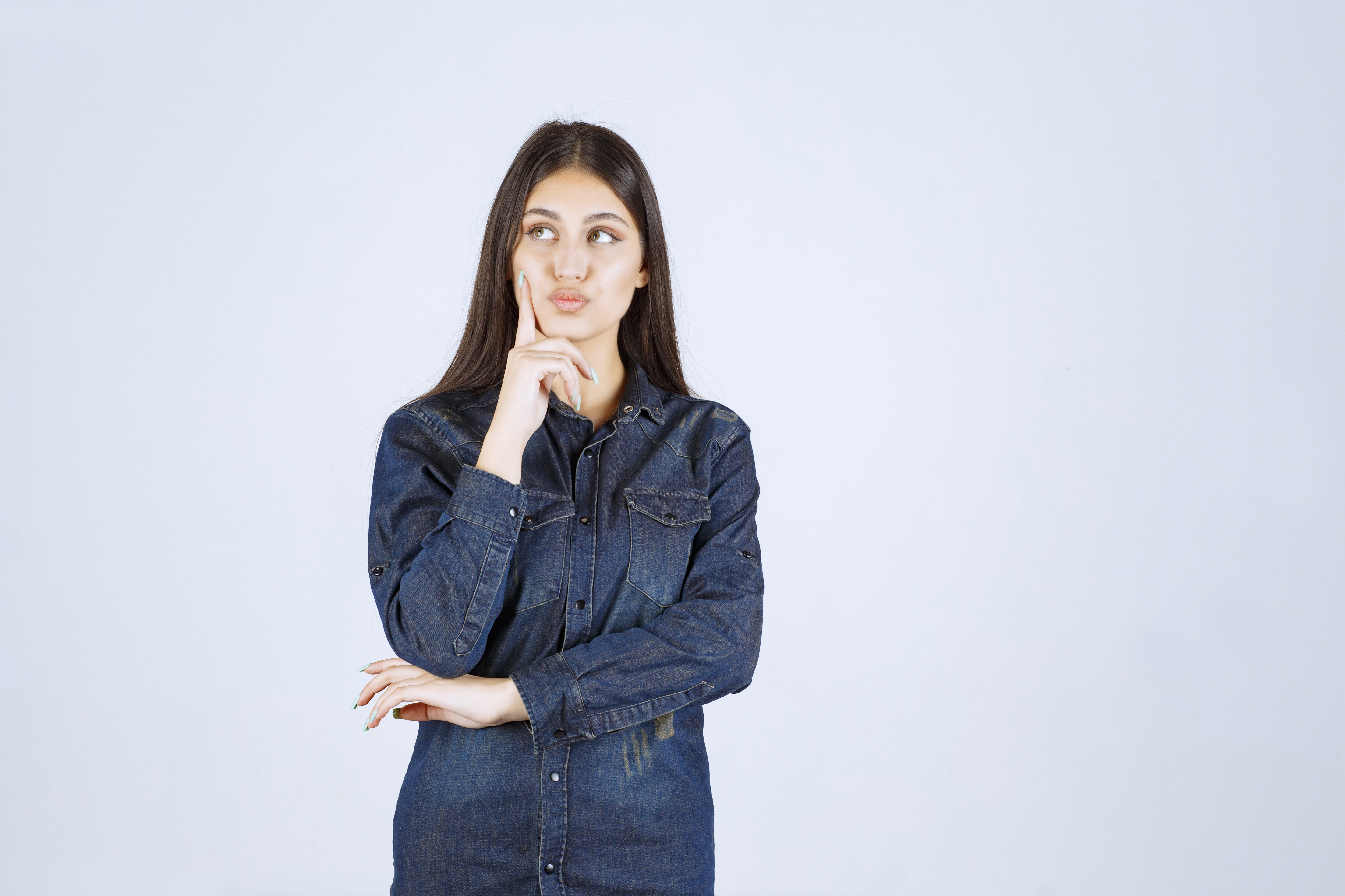 Young woman denim shirt thinking planning